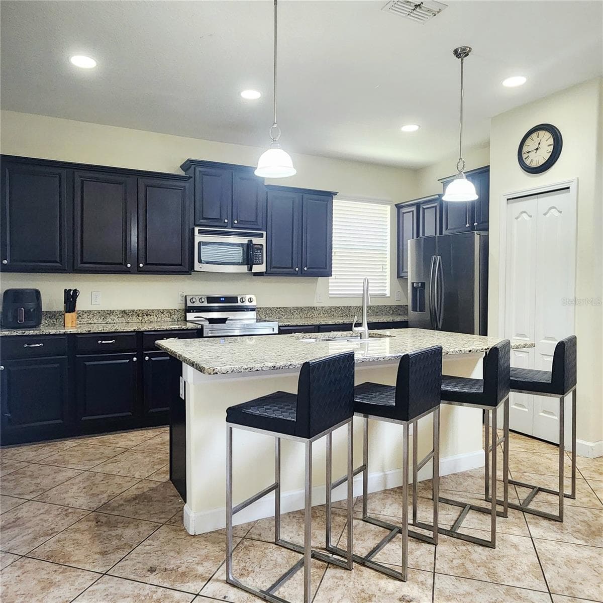 Kitchen is open to the family room. - 8935 CUBAN PALM RD, KISSIMMEE