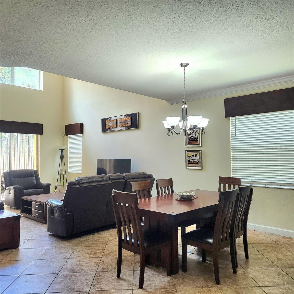 Dining room adjacent to the family room. - 8935 CUBAN PALM RD, KISSIMMEE