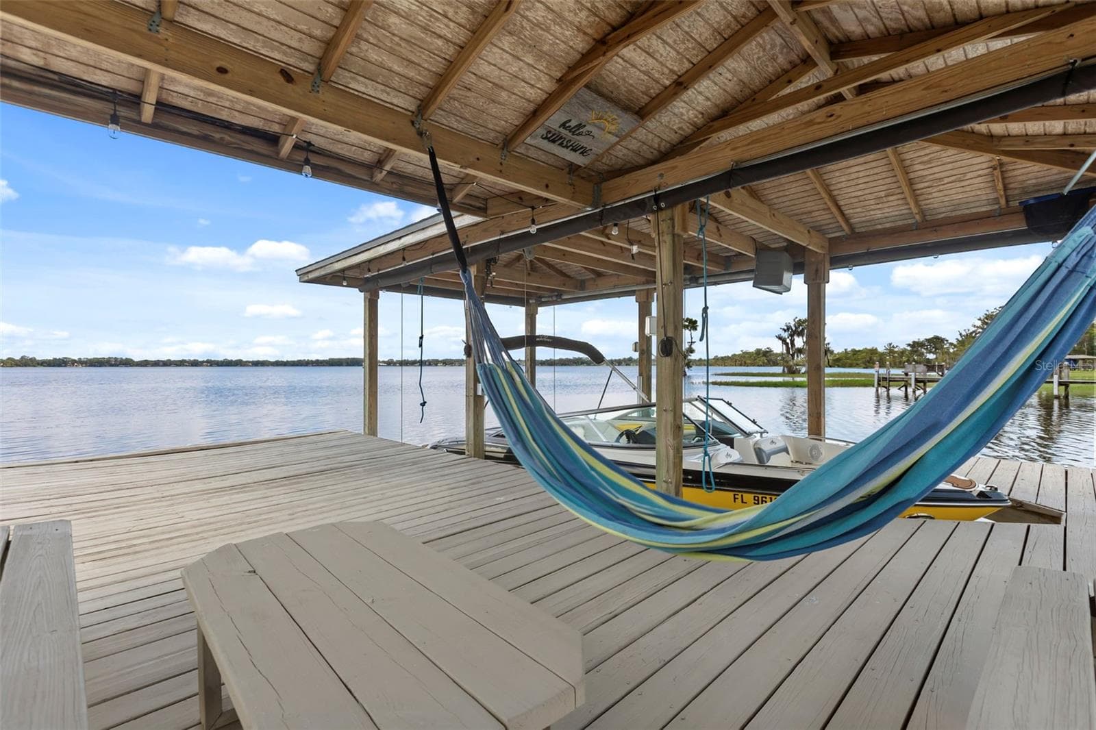 A private dock and boatlift provide immediate access to Lake Sheen and the entire Butler Chain, while a gated community boat ramp is approximately 300 feet away. - 10430 LAKE COTTAGE LN, ORLANDO