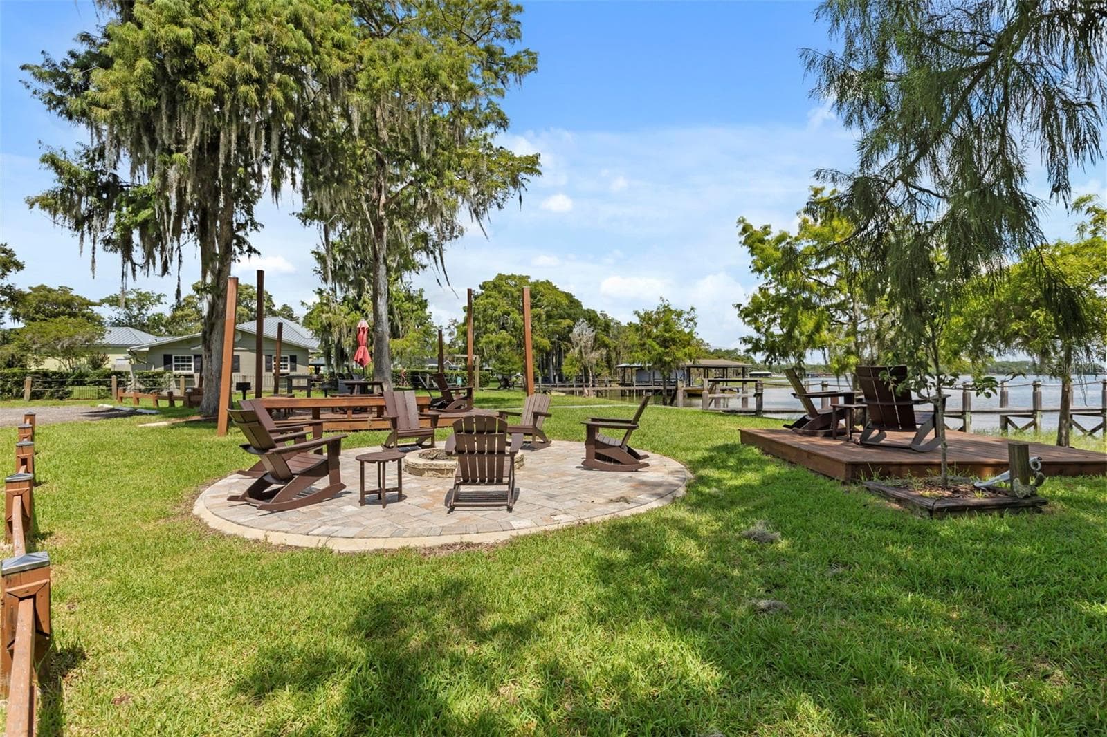 With no neighboring residence immediately on that side, the park creates an unusually open and private setting, allowing the lake, sky, and natural surroundings to take center stage. - 10430 LAKE COTTAGE LN, ORLANDO