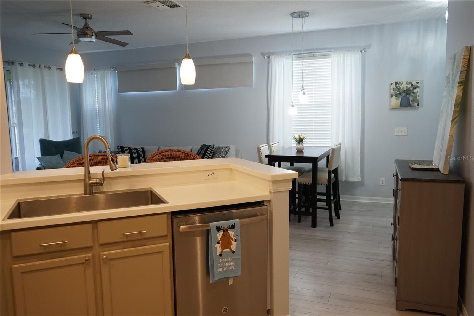sink overlooks dining and living area - 2032 INVERNESS GREENS DR #76, SUN CITY CENTER