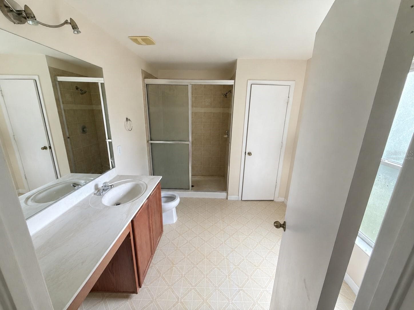 Master bathroom with walk in shower. Virtually staged - 21468 DAWSON AVE, PORT CHARLOTTE