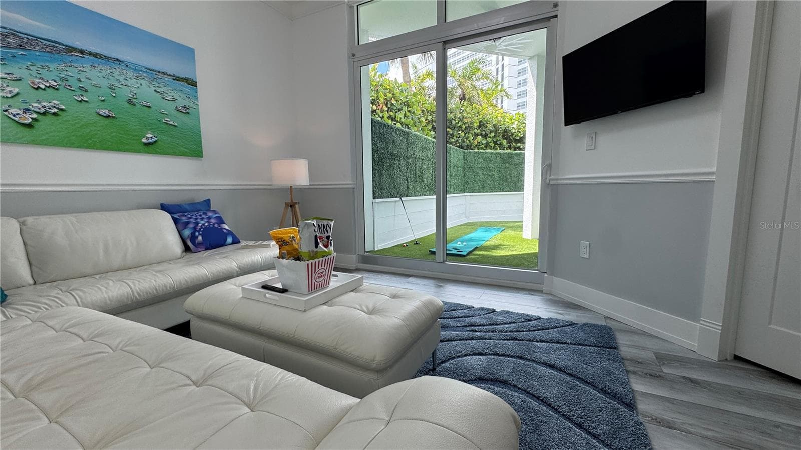 BACKYARD VIEW FROM MEDIA ROOM - 988 BLVD OF THE ARTS #109, SARASOTA