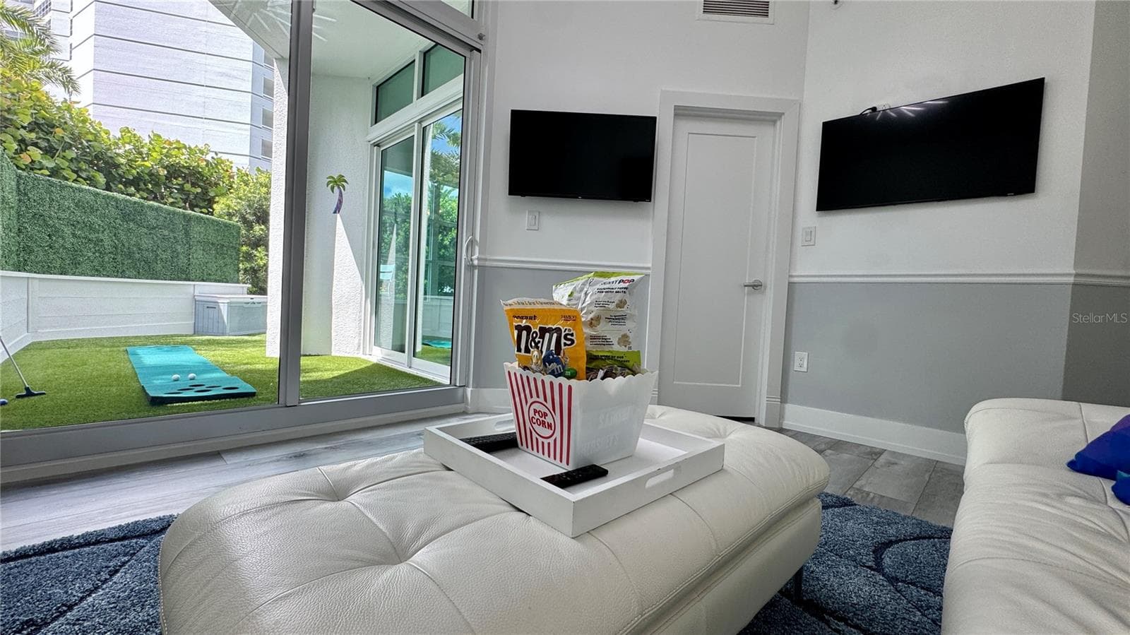 MEDIA ROOM DOUBLES AS A THIRD BEDROOM WITH A LARGE WALK-IN CLOSET - 988 BLVD OF THE ARTS #109, SARASOTA