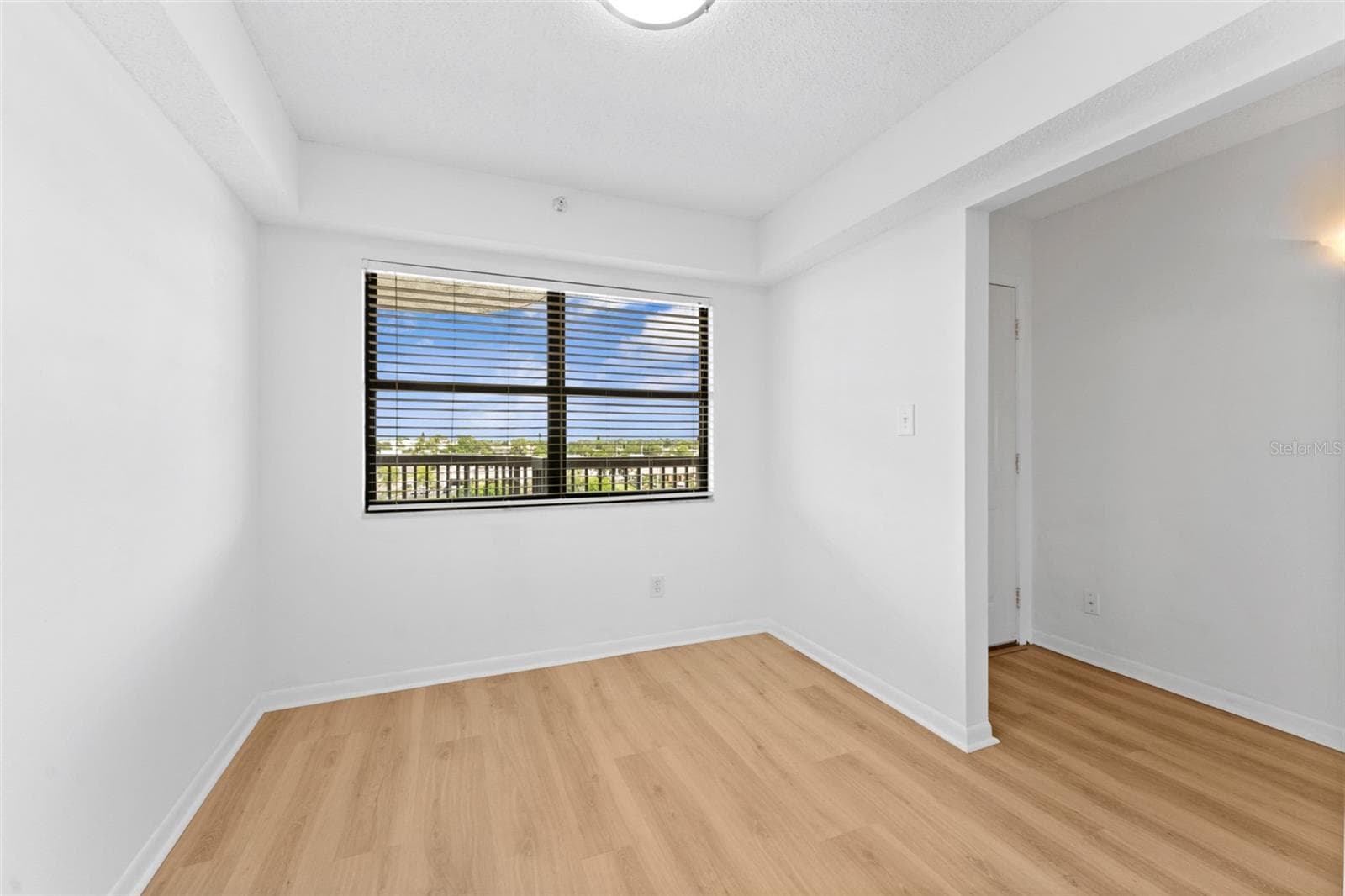 to the right of the entry is this lovely bonus room. - 5400 PARK ST N #511, ST PETERSBURG
