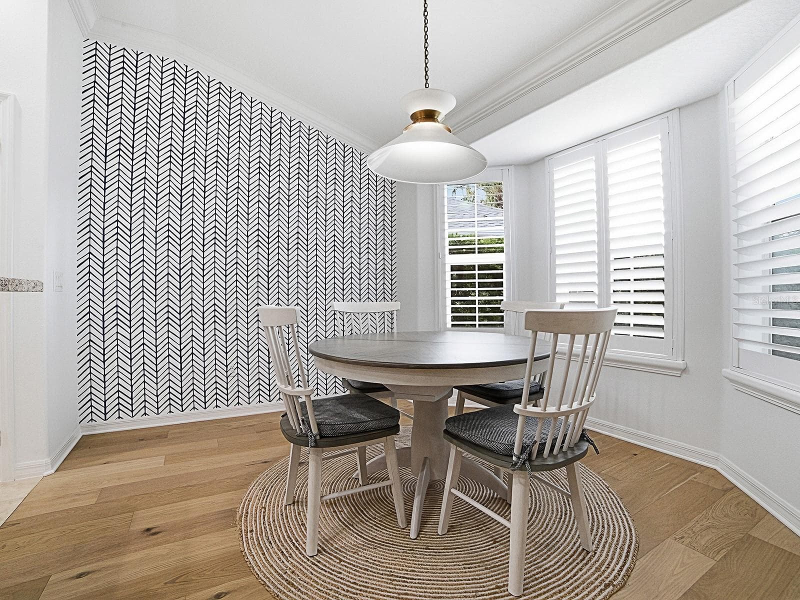 Dinette w/new decorative accent wall - 2445 BUTTONWOOD RUN, THE VILLAGES