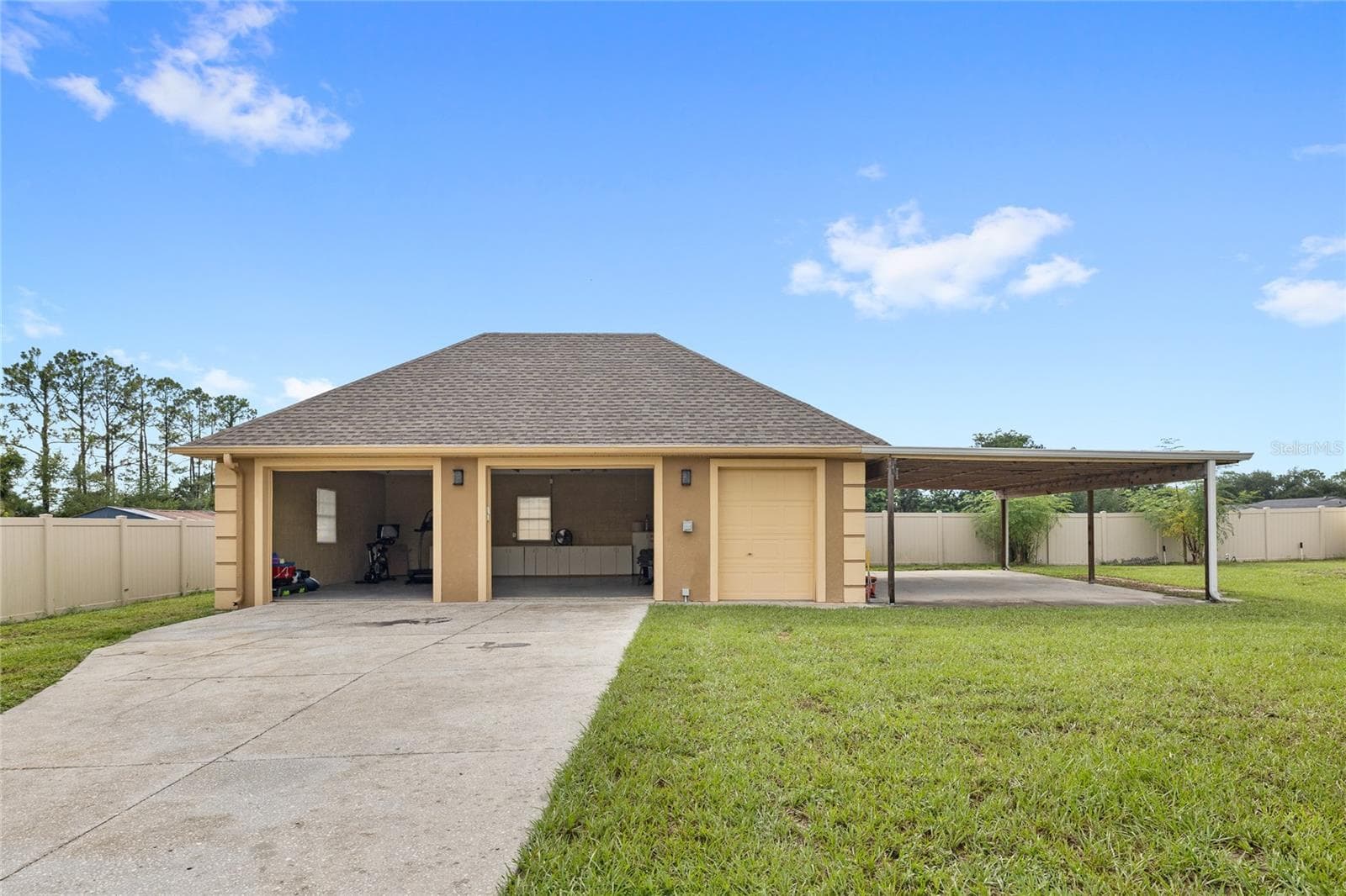 Detached two car garage with storage room and carport - 12901 PHILLIPS RD, GROVELAND