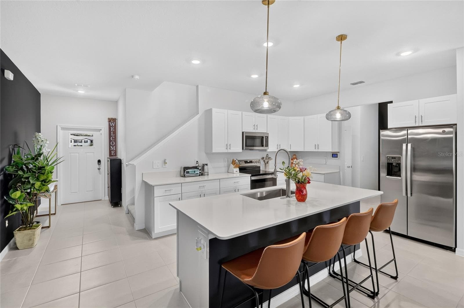 Upgraded pendant lighting in the kitchen over the island - 36227 JOSEPH BLAKE ST, ZEPHYRHILLS