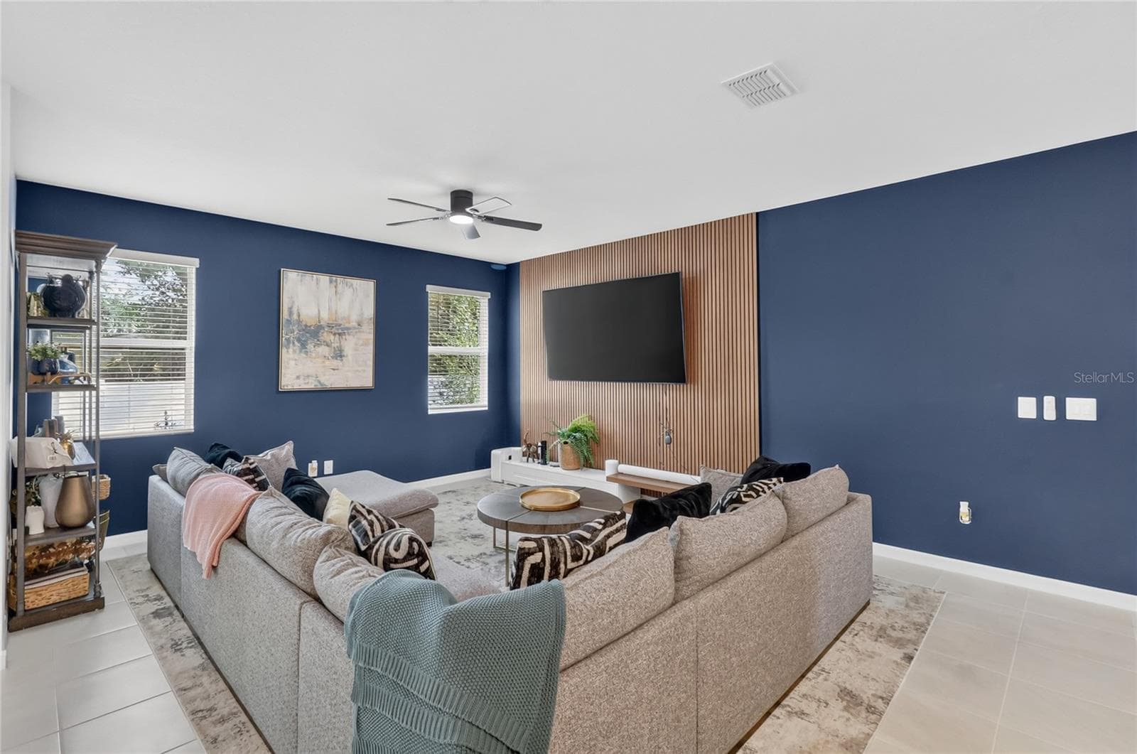 Living room with accent wall and updated tv mount. - 36227 JOSEPH BLAKE ST, ZEPHYRHILLS