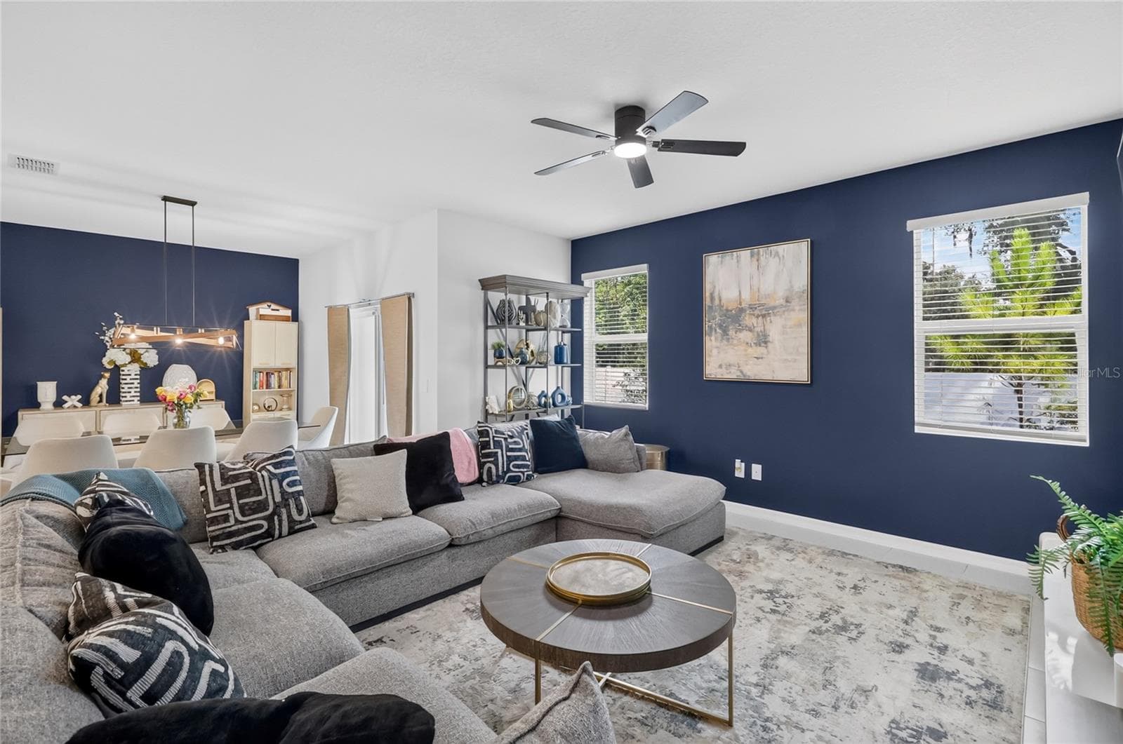 Living room and dining room.  New light over the dining room and new ceiling fan. - 36227 JOSEPH BLAKE ST, ZEPHYRHILLS