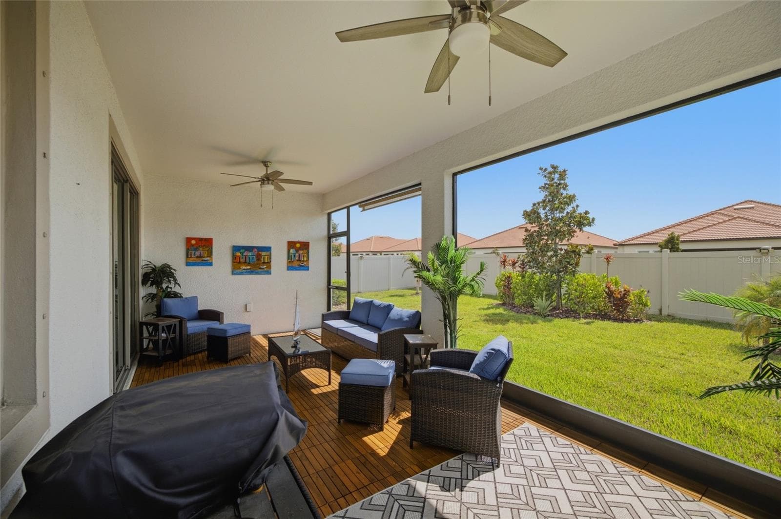 Stunning TEAK Flooring on your spacious screened lanai - 17218 STAR BANKS ST, WIMAUMA
