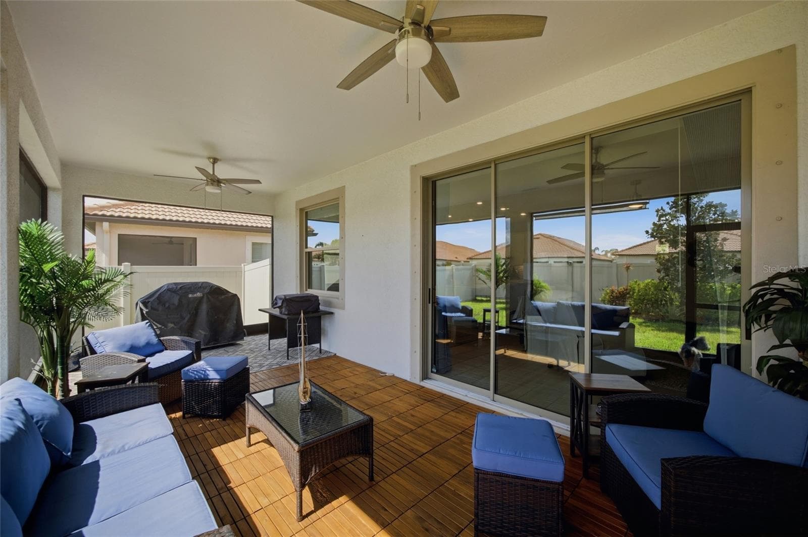 Stunning TEAK flooring on your spacious screened lanai - 17218 STAR BANKS ST, WIMAUMA