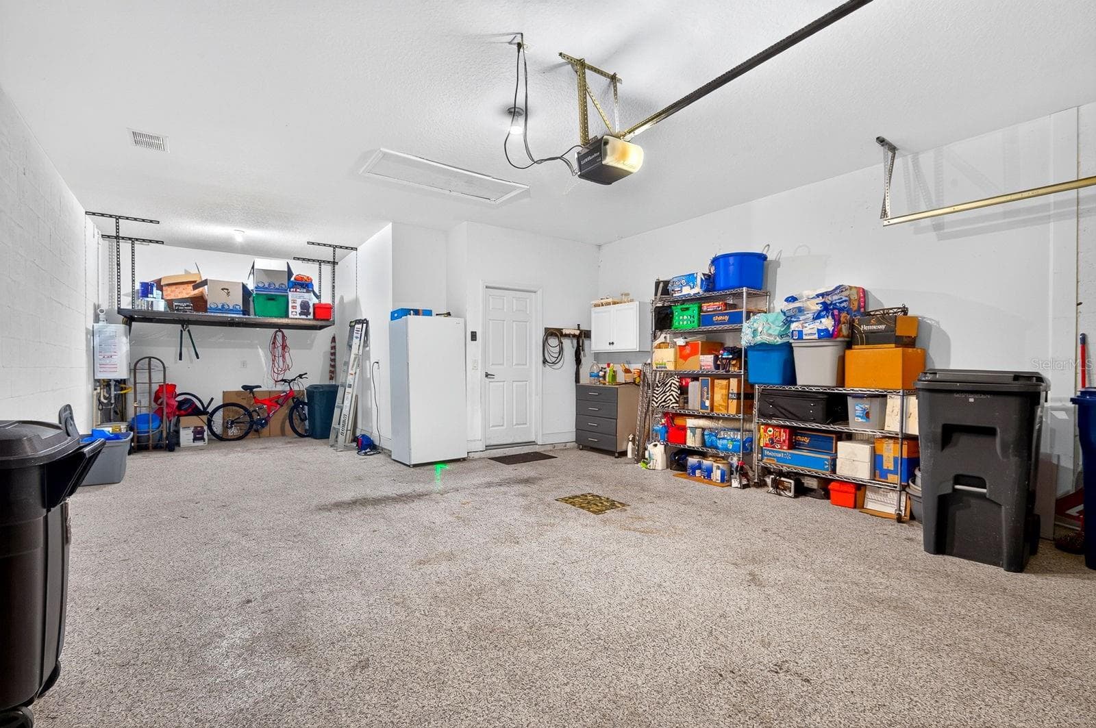 Tandem 3-Car Garage with Storage Racks - 792 ROSEMARY CIR, BRADENTON