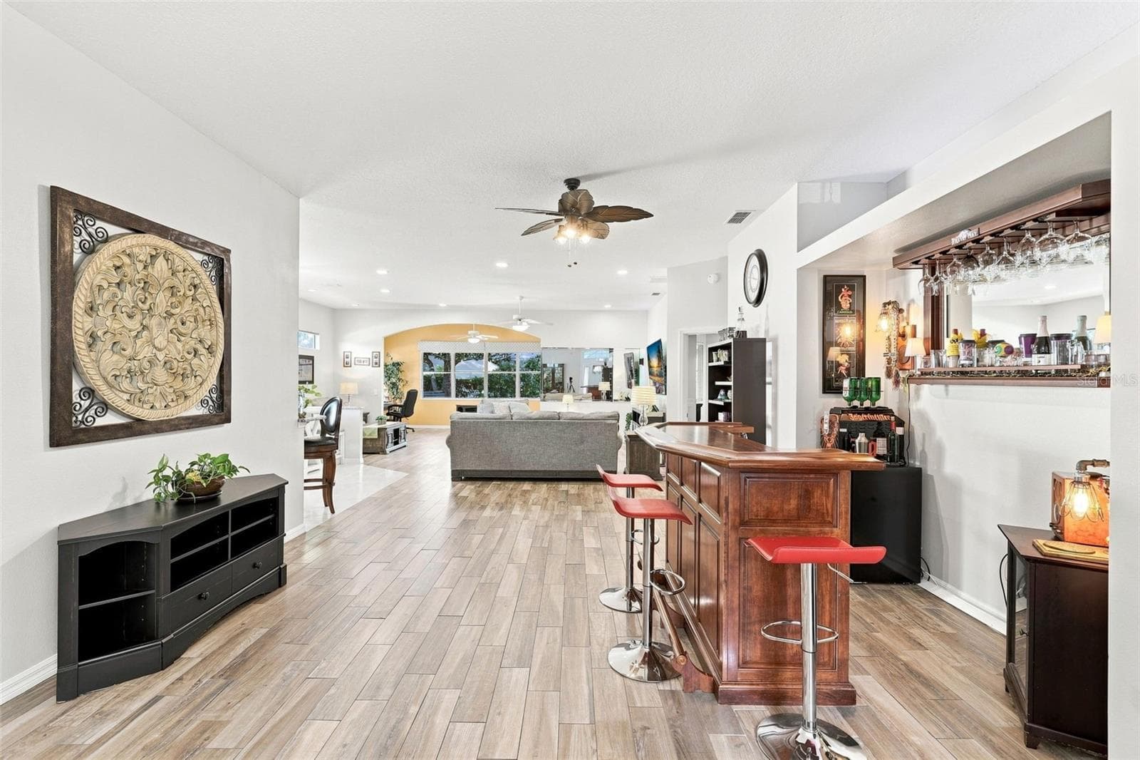 This bar space is very flexible and could also be used as Dining Room. - 367 FOXHILL DR, DEBARY