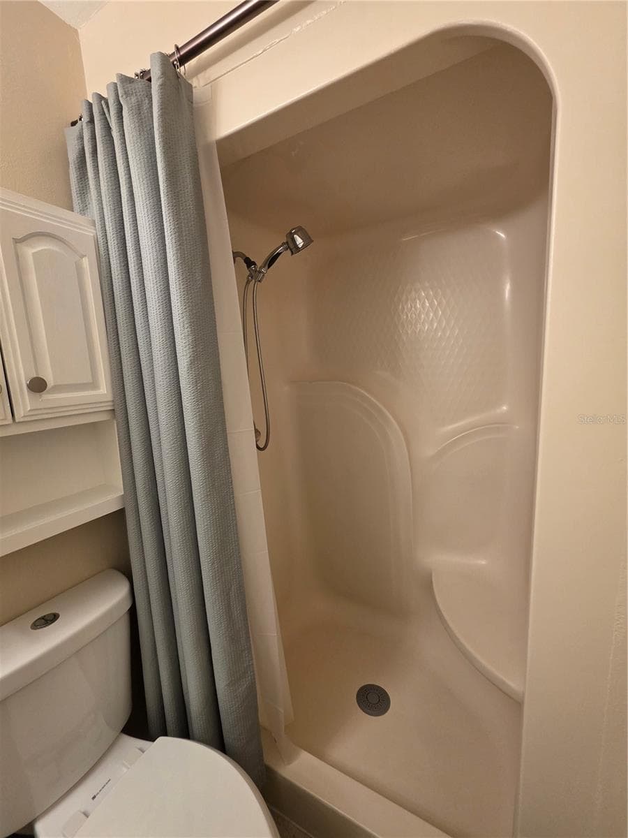 Primary bathroom shower with built in seat - 1679 SPRING GARDEN CT, HOLLY HILL