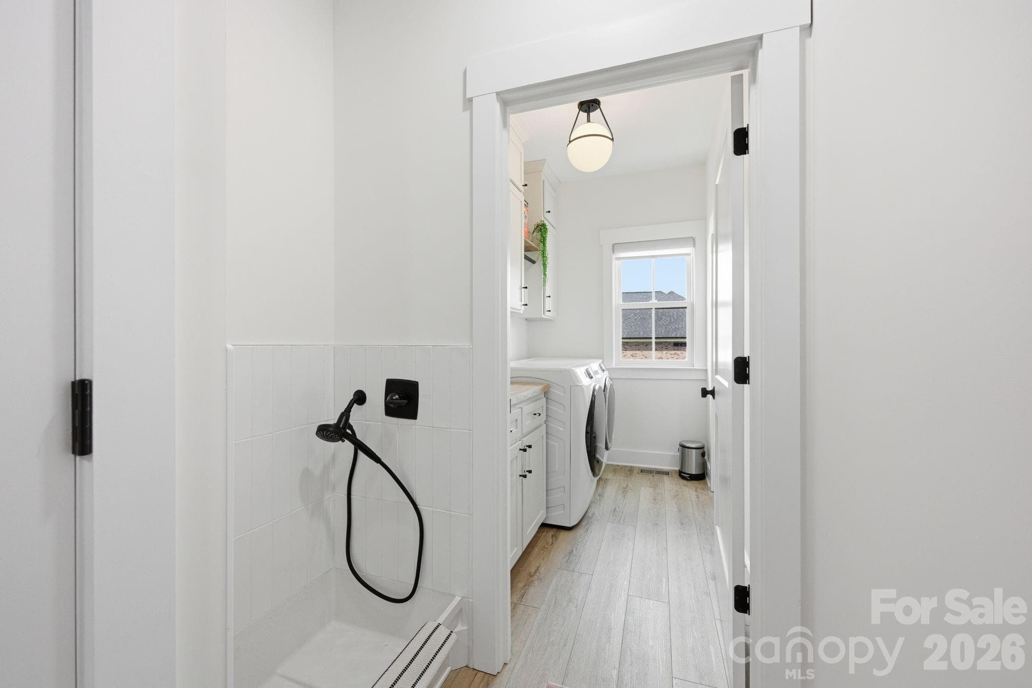 Dog Wash in Mud Room with Laundry Room Beyond - 215 Cal Kennedy Road, Cleveland