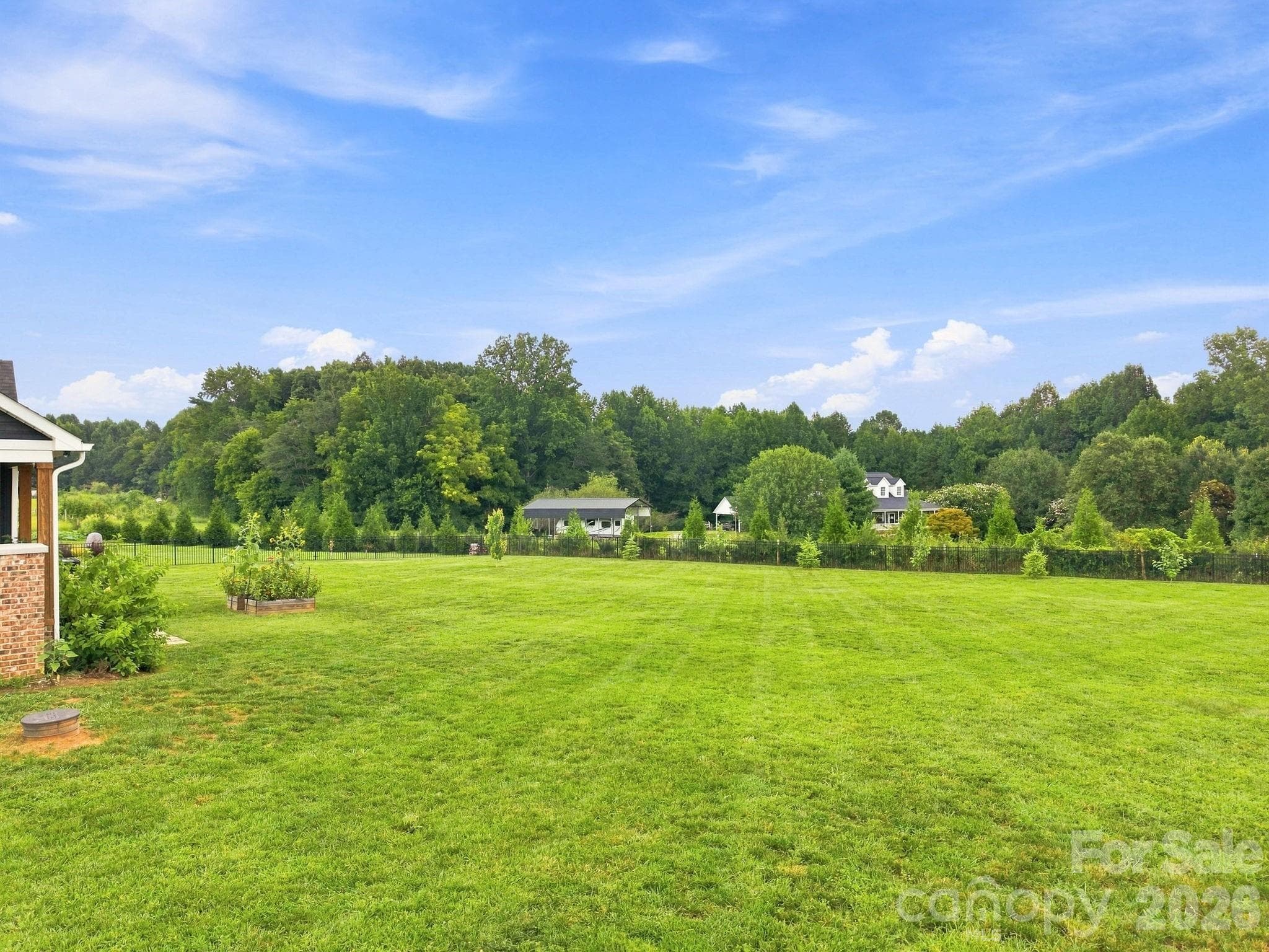 Large Back Yard with Raised Bed Flower Garden - 215 Cal Kennedy Road, Cleveland