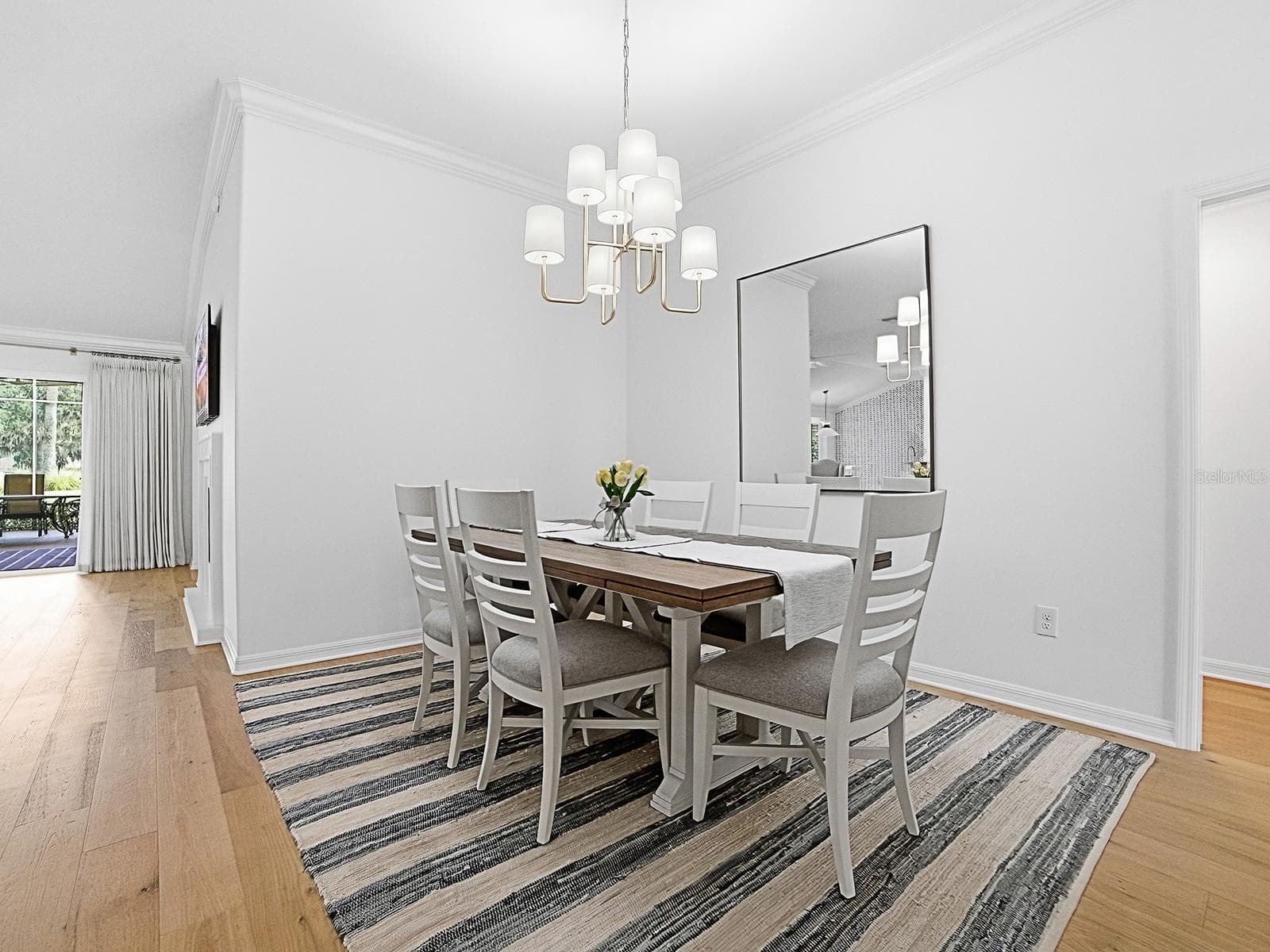 Dining Room with updated modern chandelier - 2445 BUTTONWOOD RUN, THE VILLAGES