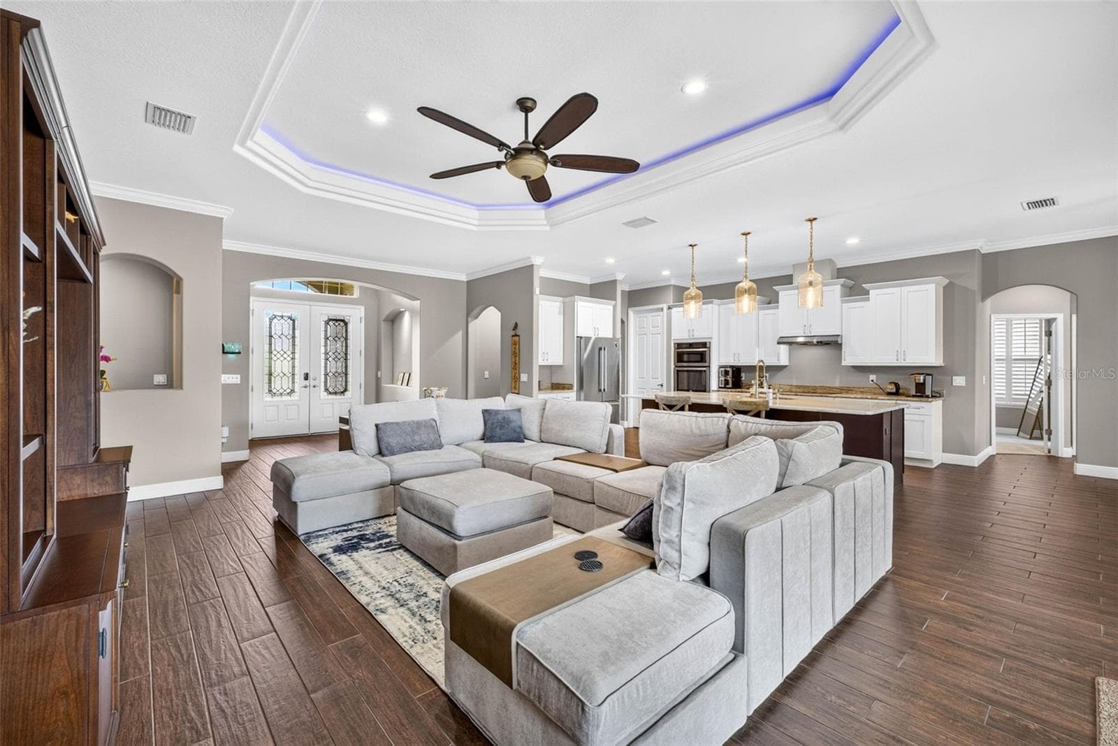 Living Room with view of kitchen and foyer - 4760 LAGO VISTA CIR, LAND O LAKES