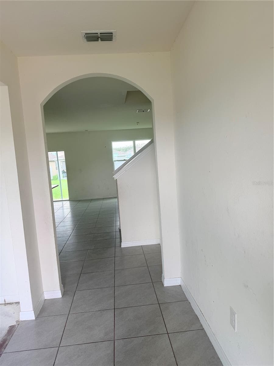 Tile Flooring in hallway and Family Room - 1550 OAK RESERVE DR, KISSIMMEE