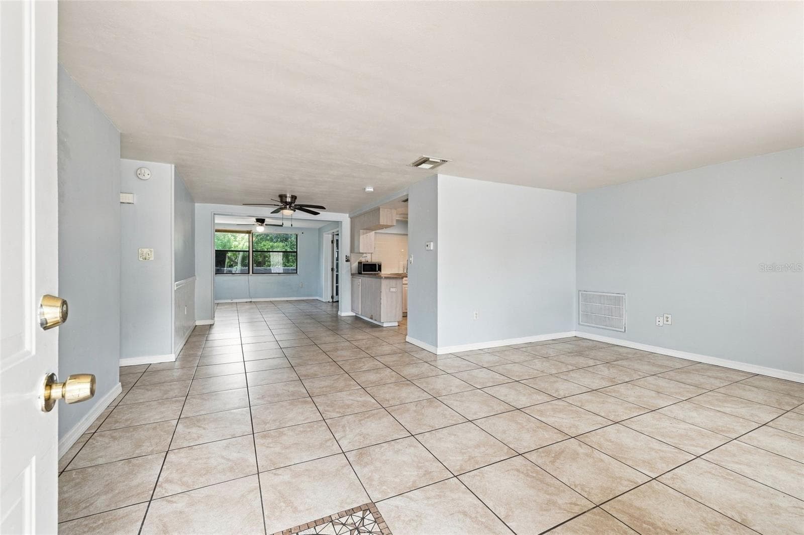 Living Room with Tile Flooring - 3431 OVERLAND DR, HOLIDAY