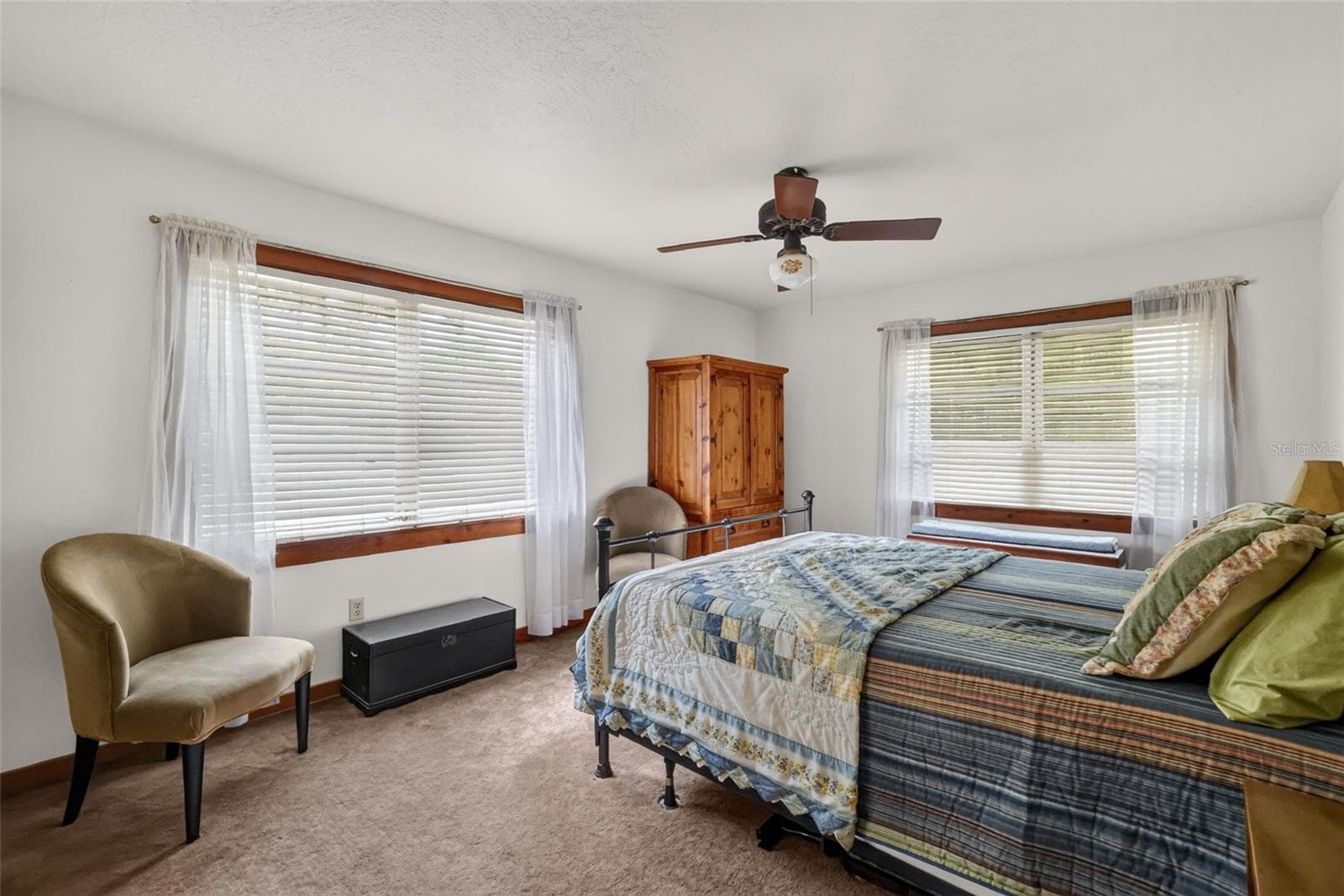 11' x 15' primary bedroom with ceiling fan and two large windows - 24939 OLD DEER RD, PAISLEY