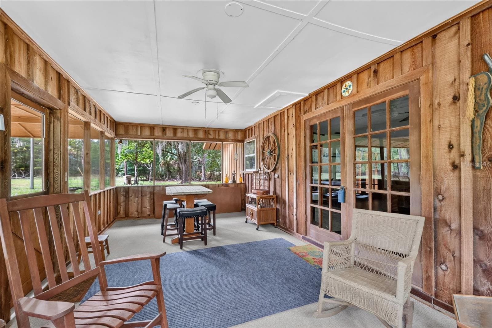 11' x 23' screened porch, main entry into home through French doors. - 24939 OLD DEER RD, PAISLEY