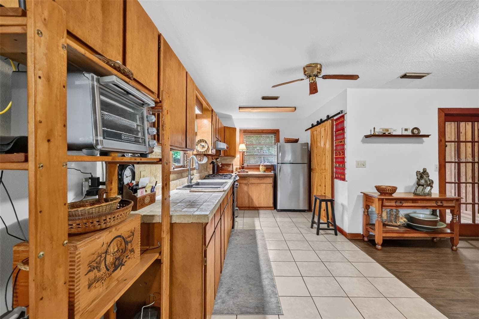Long view featuring 8' x 15' of tiled floor as well as tiled counter - 24939 OLD DEER RD, PAISLEY