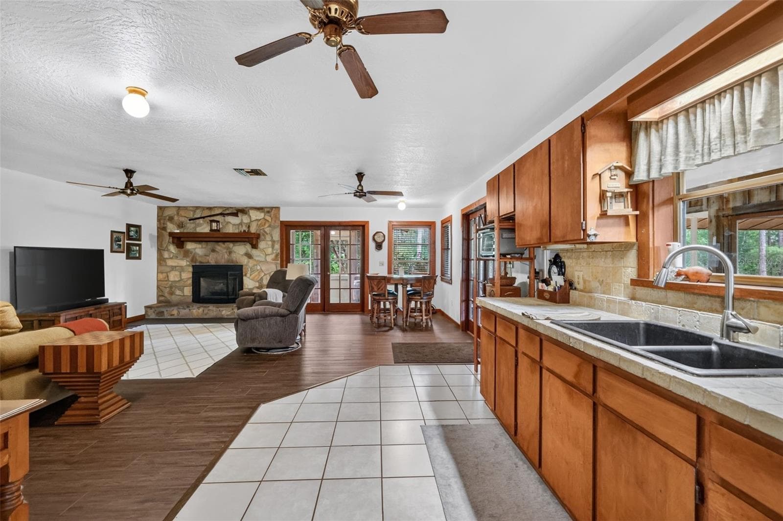 Long view from kitchen into the great room featuring new laminate flooring - 24939 OLD DEER RD, PAISLEY