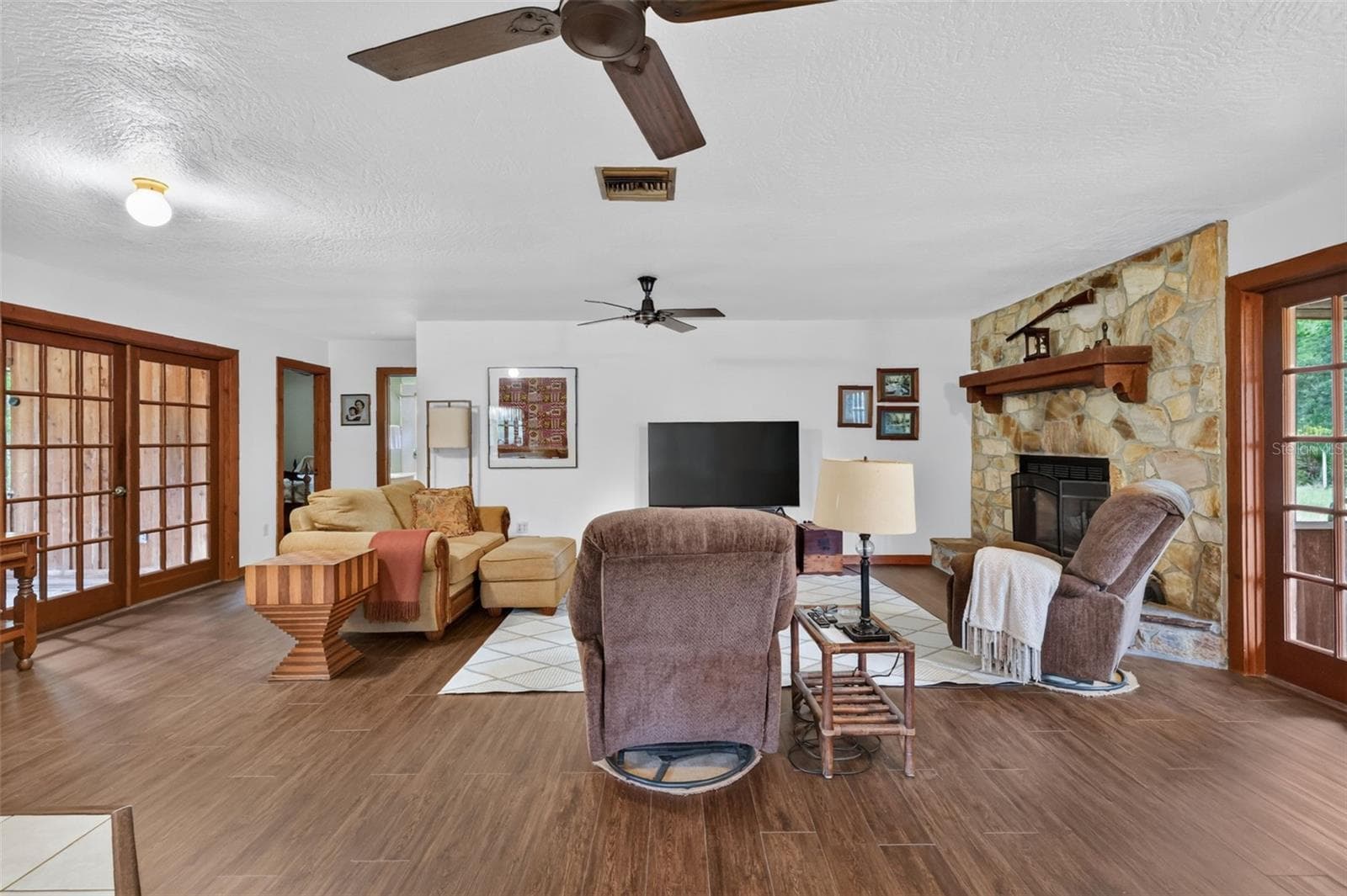 Additional view through the great room, hallway to bedrooms and bathroom is on the left side - 24939 OLD DEER RD, PAISLEY