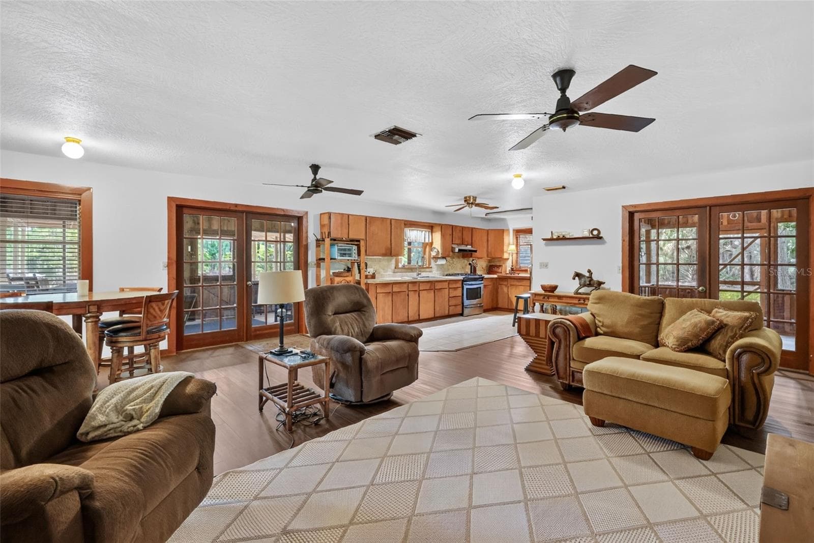 Long view from great room corner back to the kitchen - 24939 OLD DEER RD, PAISLEY