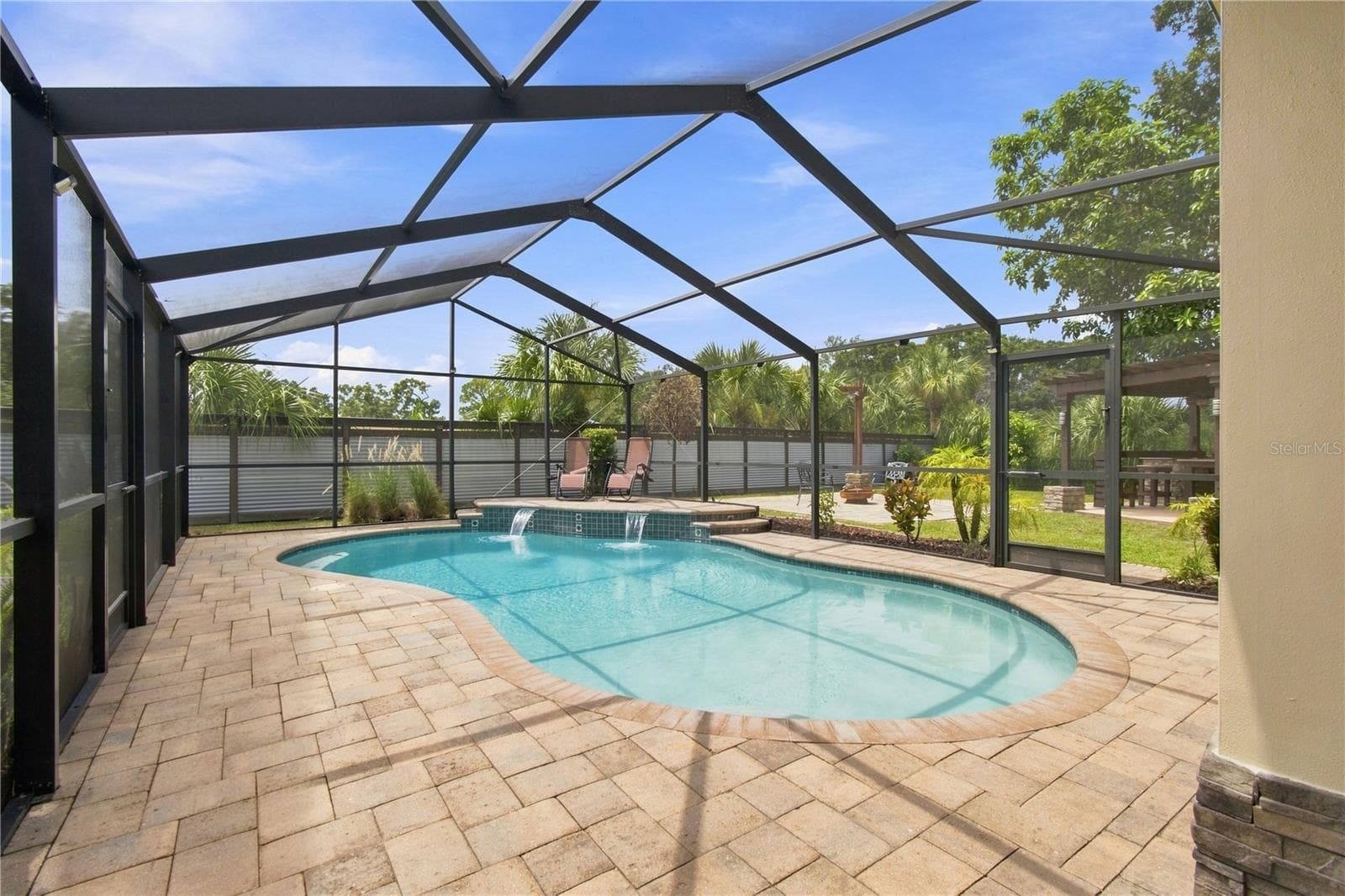 Sparkling pool with water cascade feature - 9020 AUBURN WAY, TAMPA