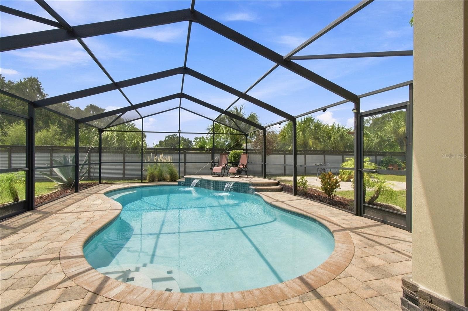 Sparkling pool with water cascade feature - 9020 AUBURN WAY, TAMPA