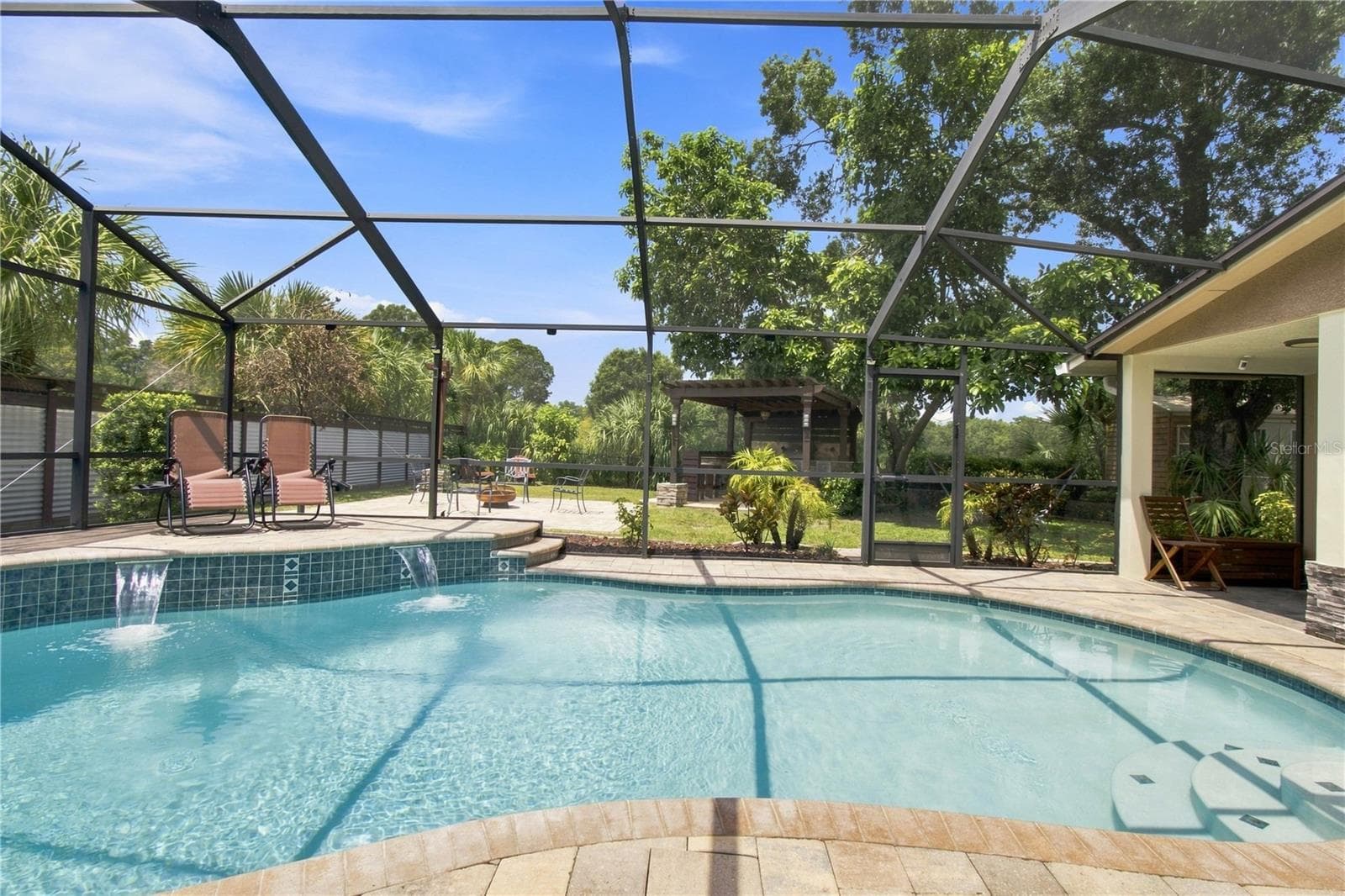 Sparkling pool with water cascade feature - 9020 AUBURN WAY, TAMPA