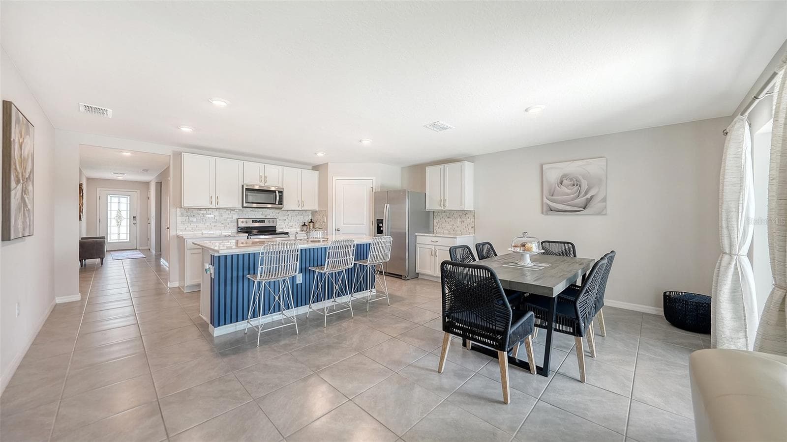 Kitchen and Dining area. - 10402 CHARLOTTE DR, PARRISH