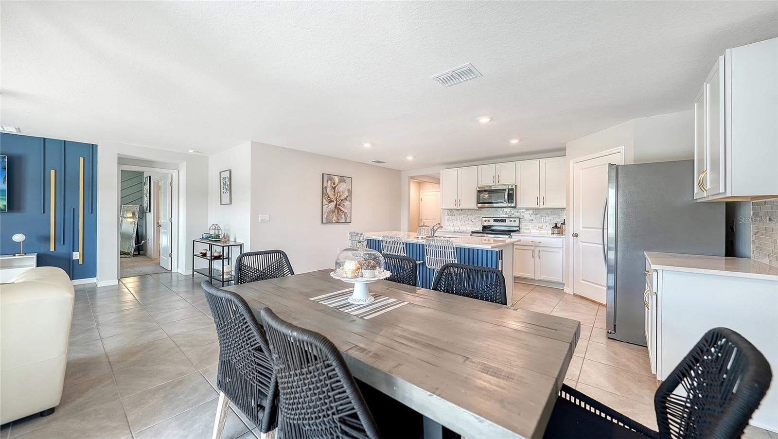 Dining area looking into the kitchen. - 10402 CHARLOTTE DR, PARRISH