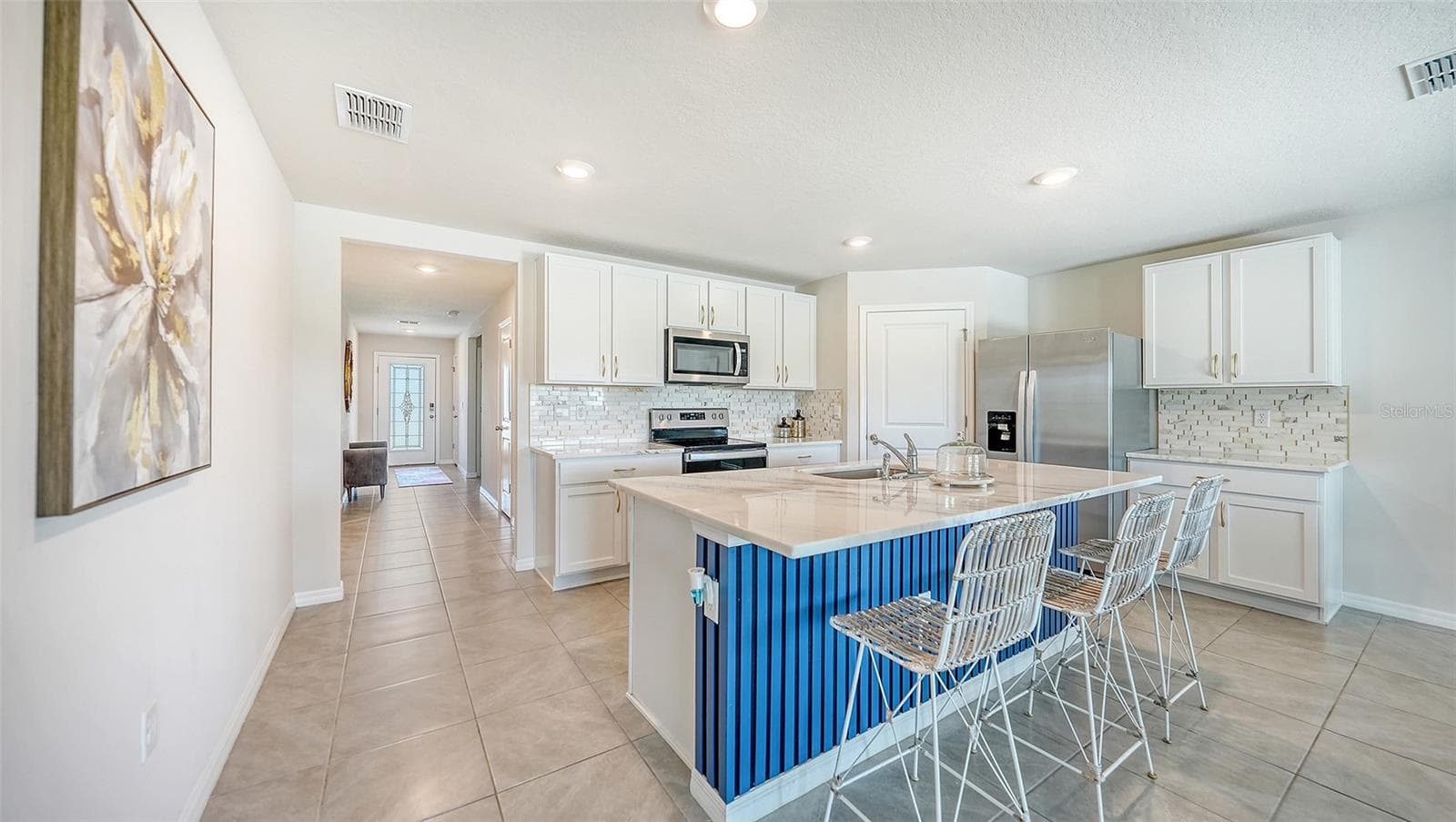 Designed accent wall at the kitchen bar. - 10402 CHARLOTTE DR, PARRISH