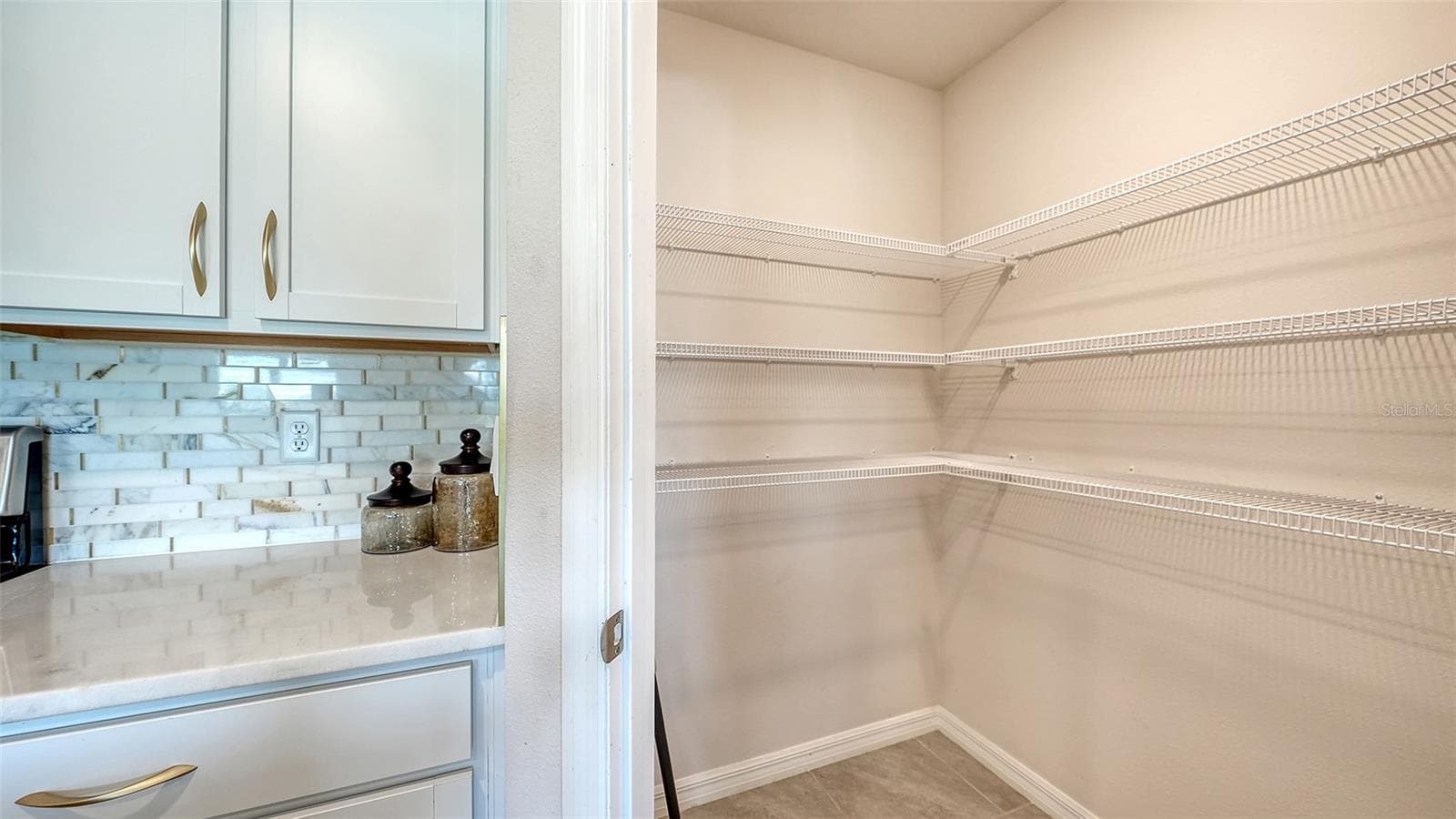 Spacious kitchen walk-in pantry. - 10402 CHARLOTTE DR, PARRISH