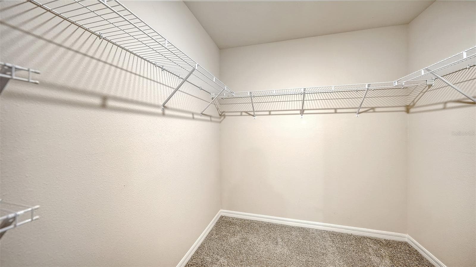 Primary bedroom spacious walk-in closet. - 10402 CHARLOTTE DR, PARRISH