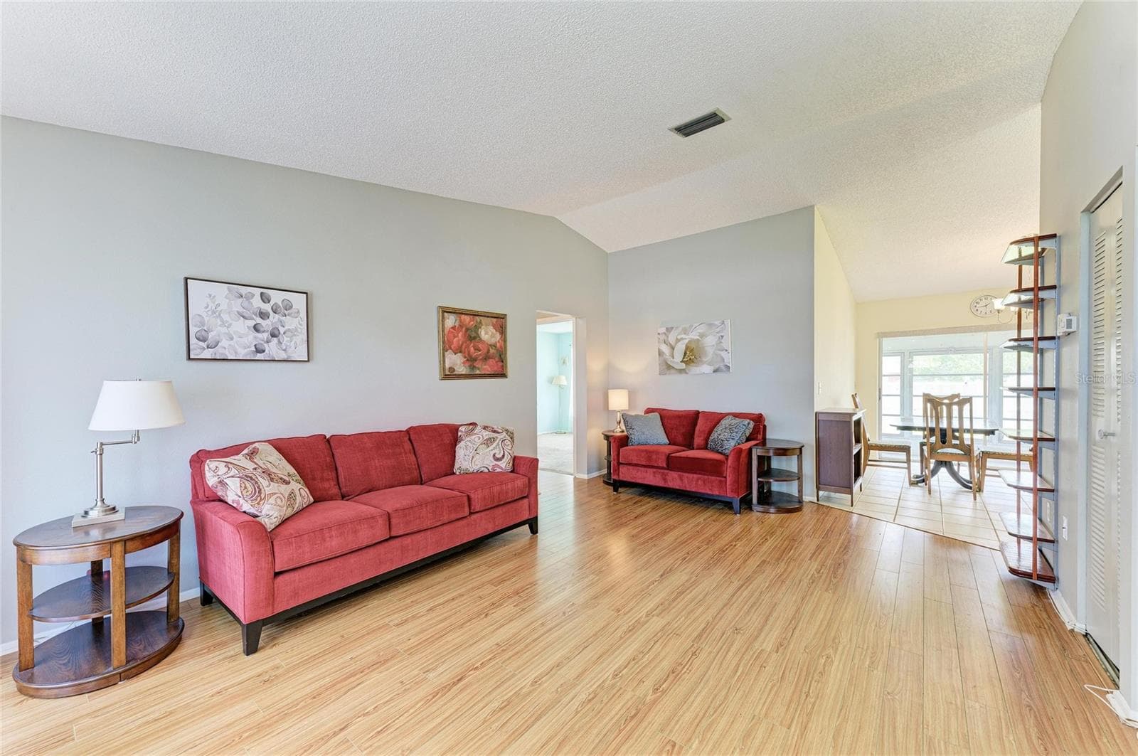 Living room leading into the kitchen. - 3403 36TH ST W #109, BRADENTON