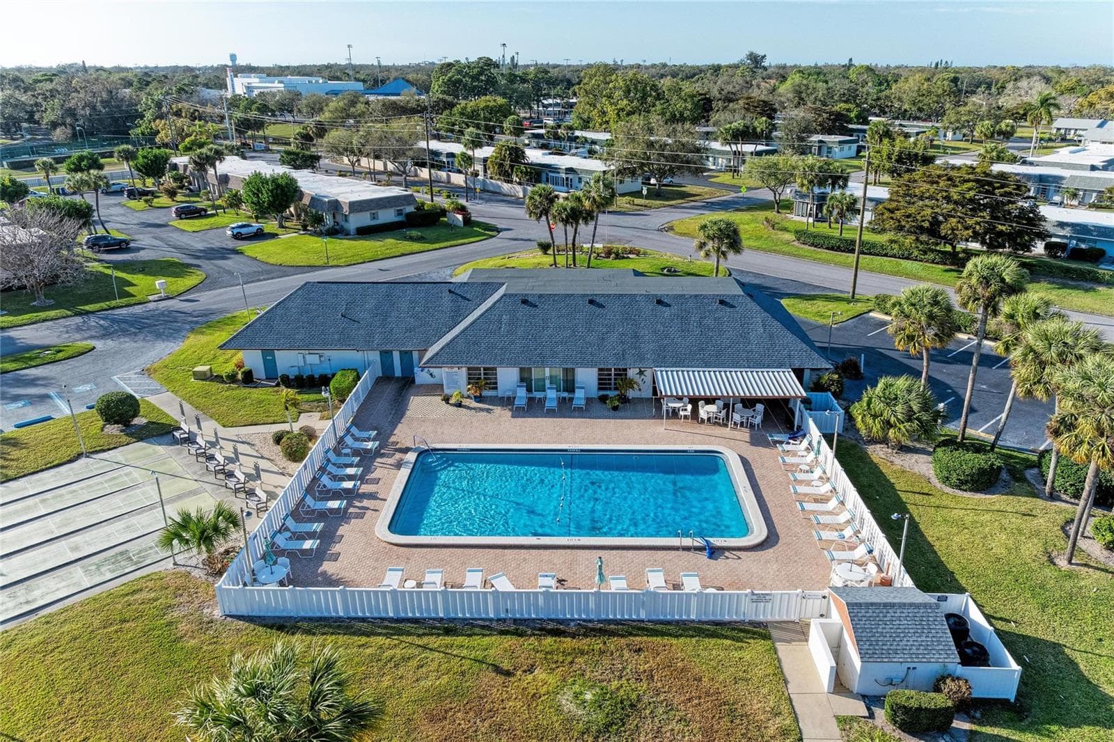 Pool and clubhouse with shuffleboard to the left - 3403 36TH ST W #109, BRADENTON
