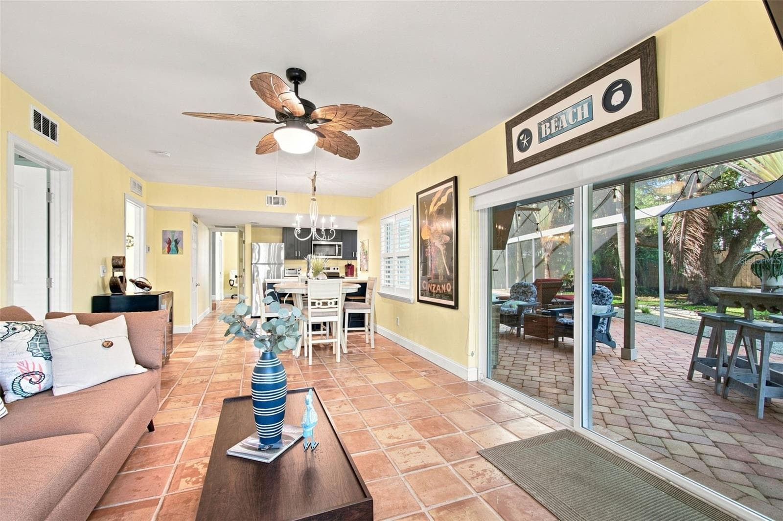 Downstairs Living area with access to pool - 201 LAGOON DR, PALM HARBOR