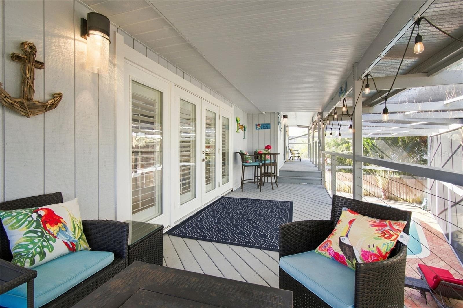 Covered Balcony upstairs outside of main living area - 201 LAGOON DR, PALM HARBOR