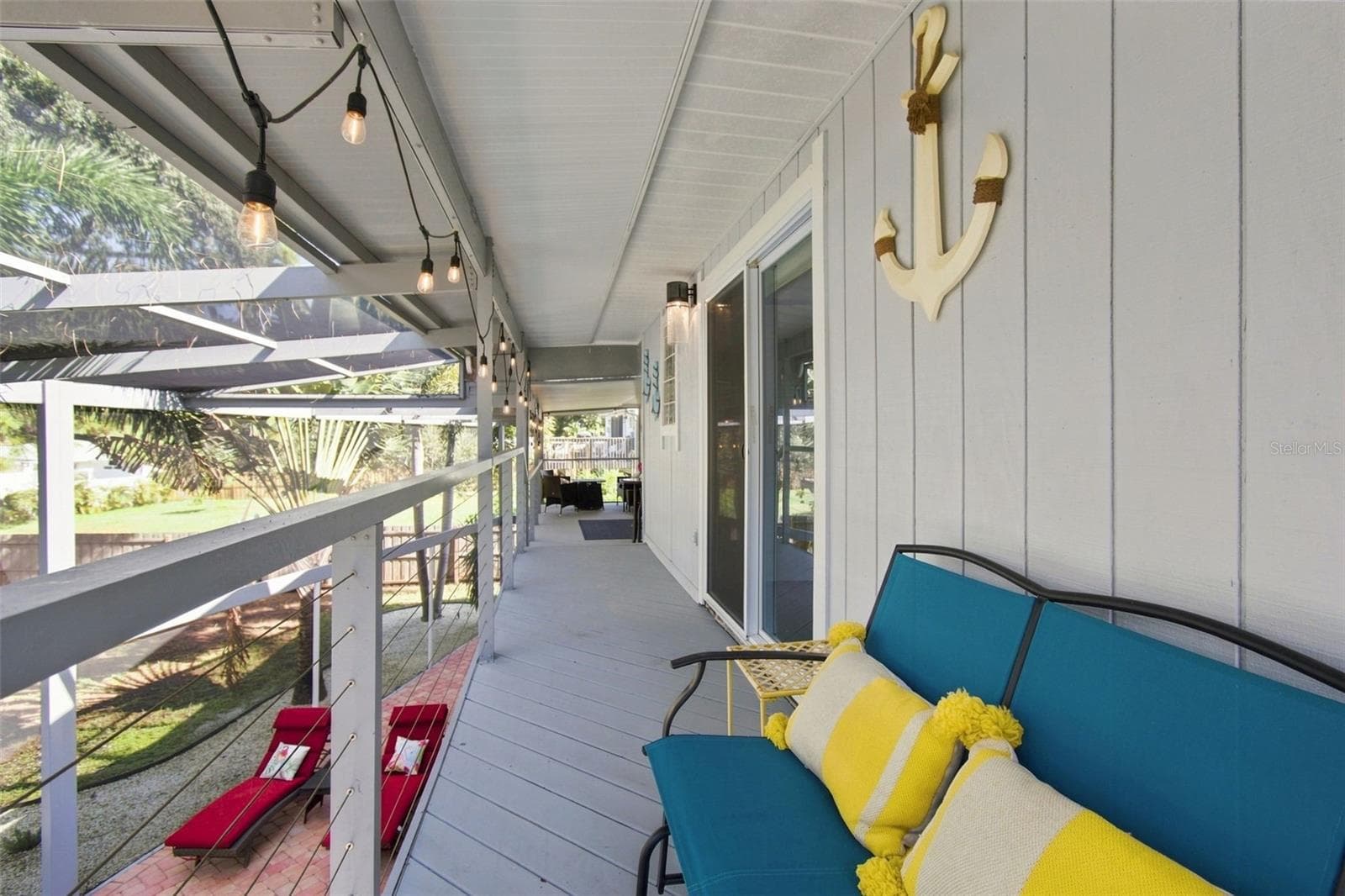 Covered Balcony area upstairs outside Primary - 201 LAGOON DR, PALM HARBOR