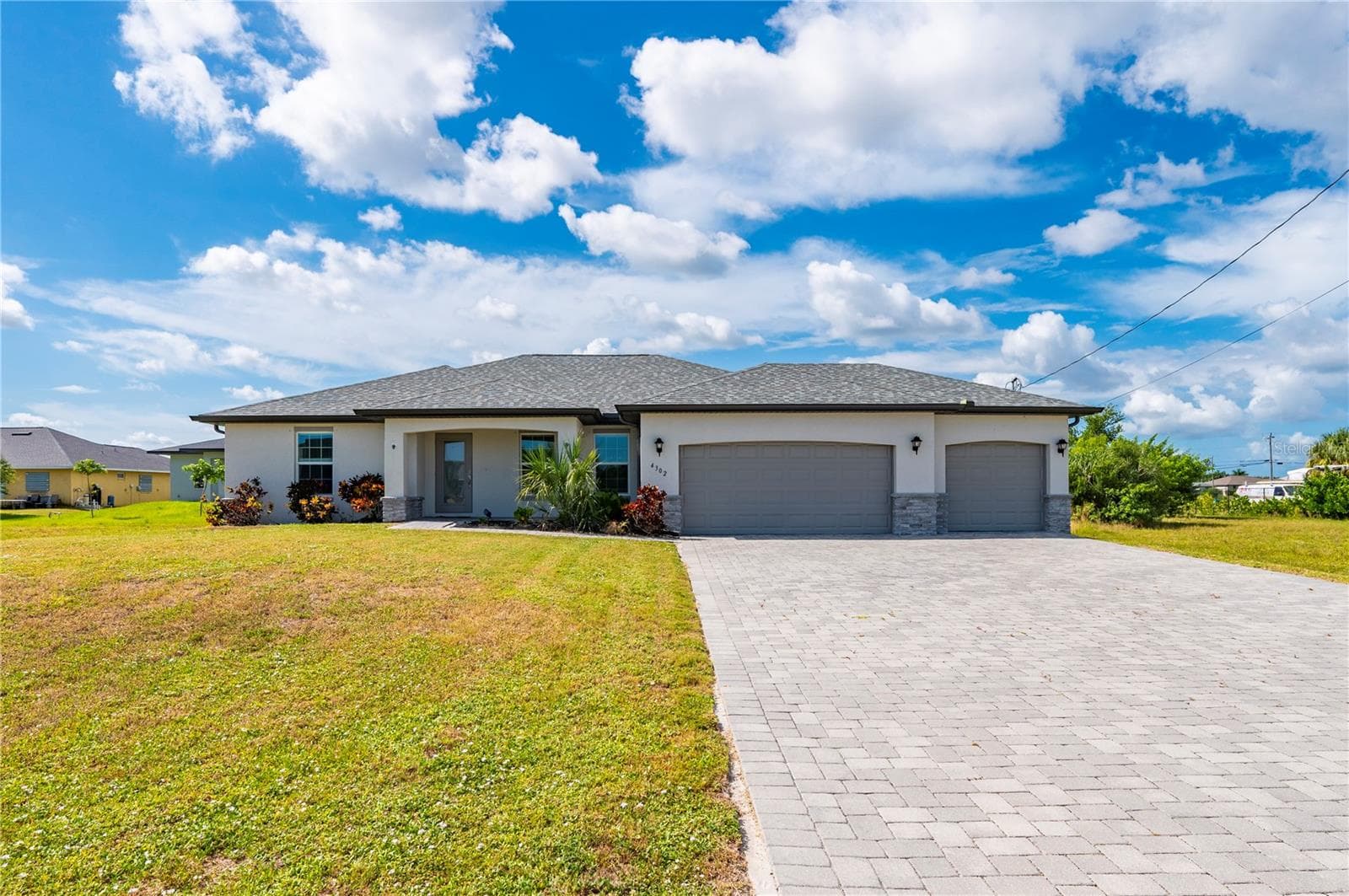 Outside View of Home with Pavered Driveway - 4302 NW 32ND ST, CAPE CORAL