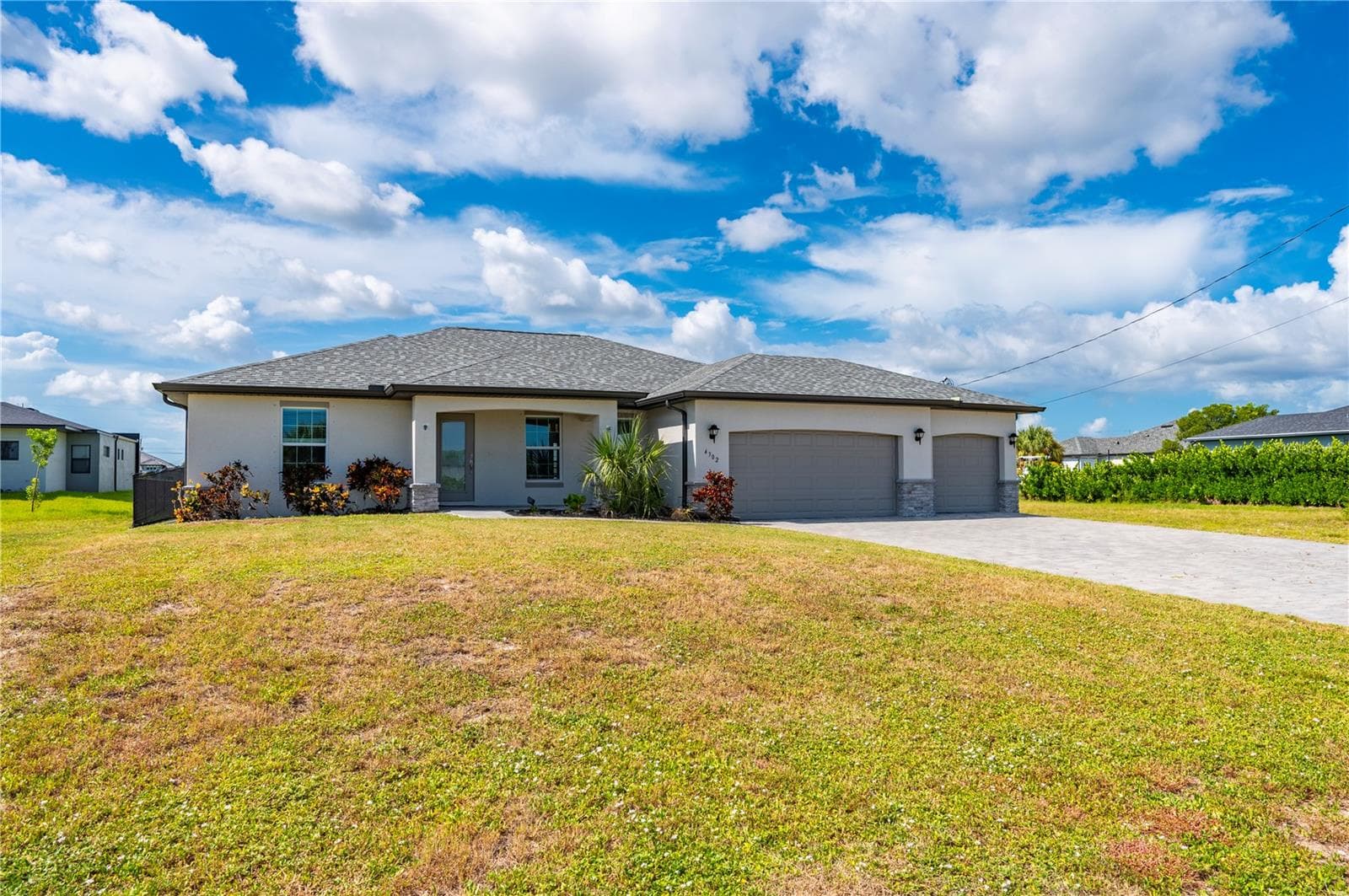 Outside View of Home with Pavered Driveway - 4302 NW 32ND ST, CAPE CORAL