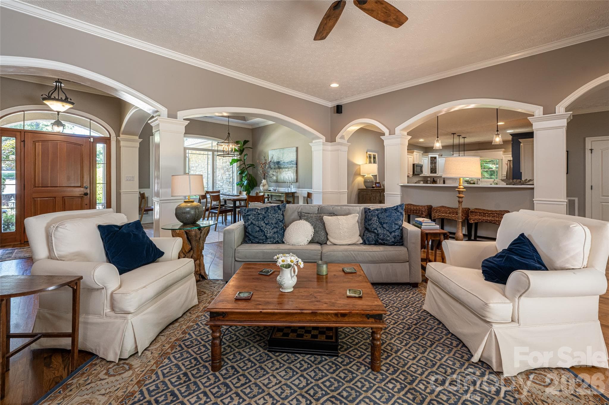 Looking through arches to kitchen from living room - 170 Cape Martin Circle, Hendersonville