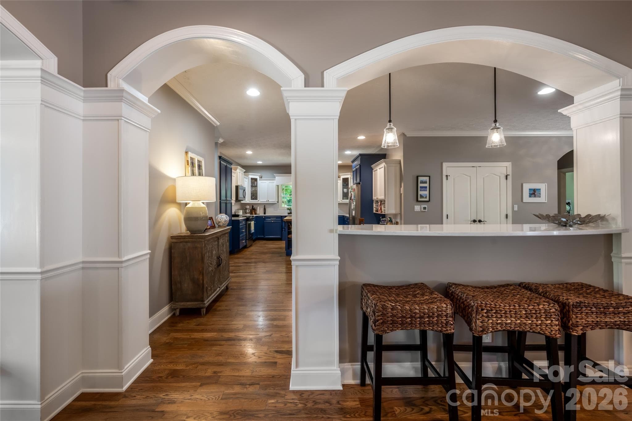 Looking through arches to kitchen from living room - 170 Cape Martin Circle, Hendersonville