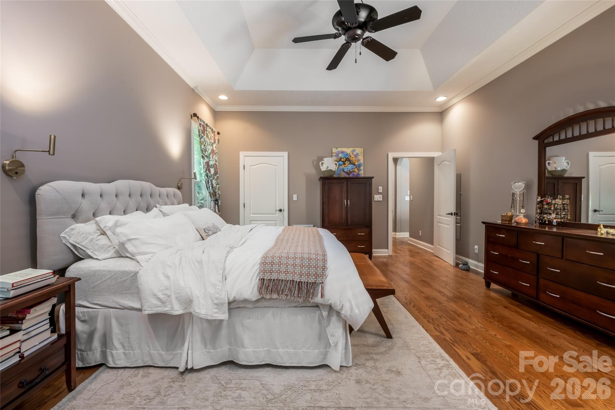 Primary bedroom with two walk in closets, Primary bath, main level, with walk in shower and jet tub, and upper deck access to covered area. - 170 Cape Martin Circle, Hendersonville