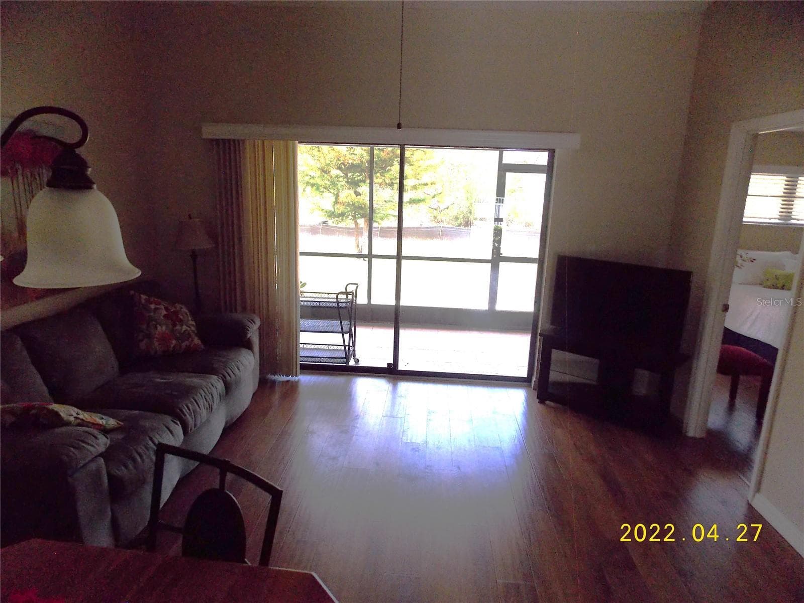 View from living room to lanai - 26267 NORTHERN CROSS RD #6C, PUNTA GORDA